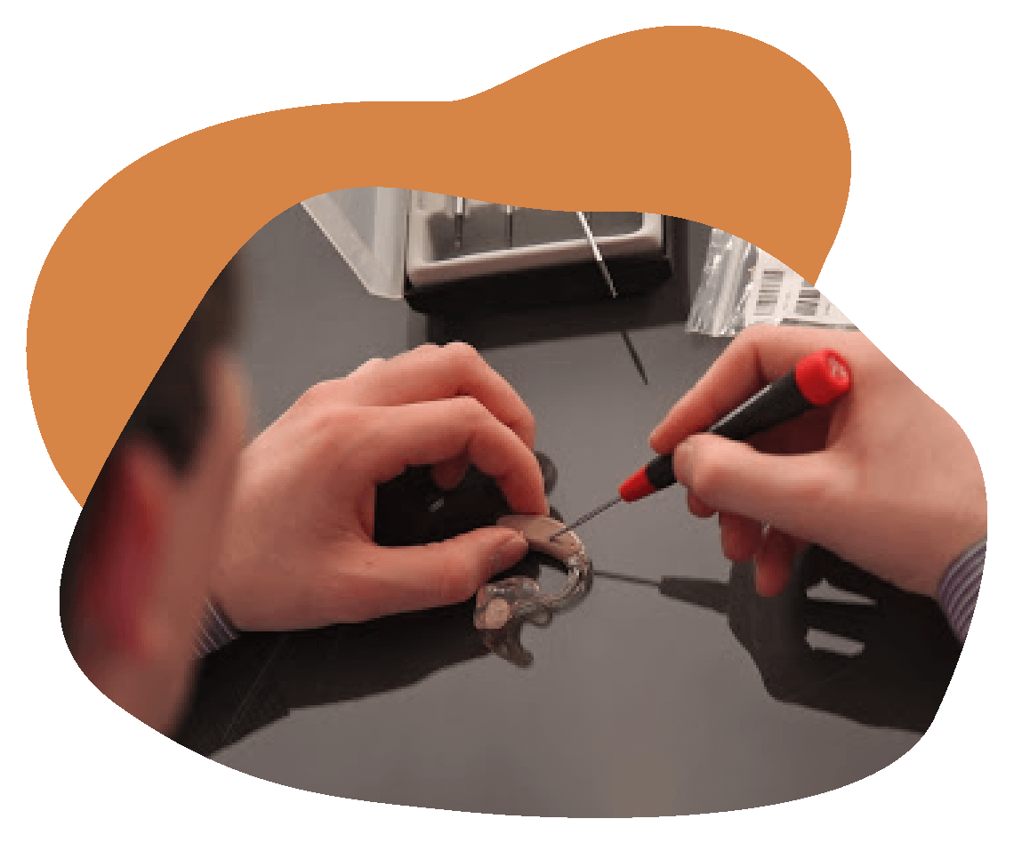 Test_Shapes-13 Person repairing a hearing aid