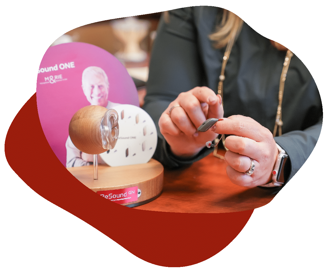 Test_Shapes_3-09 Woman holding hearing aid