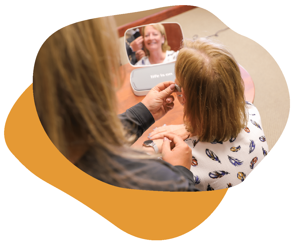 Test_Shapes_3-10 Woman getting hearing aid