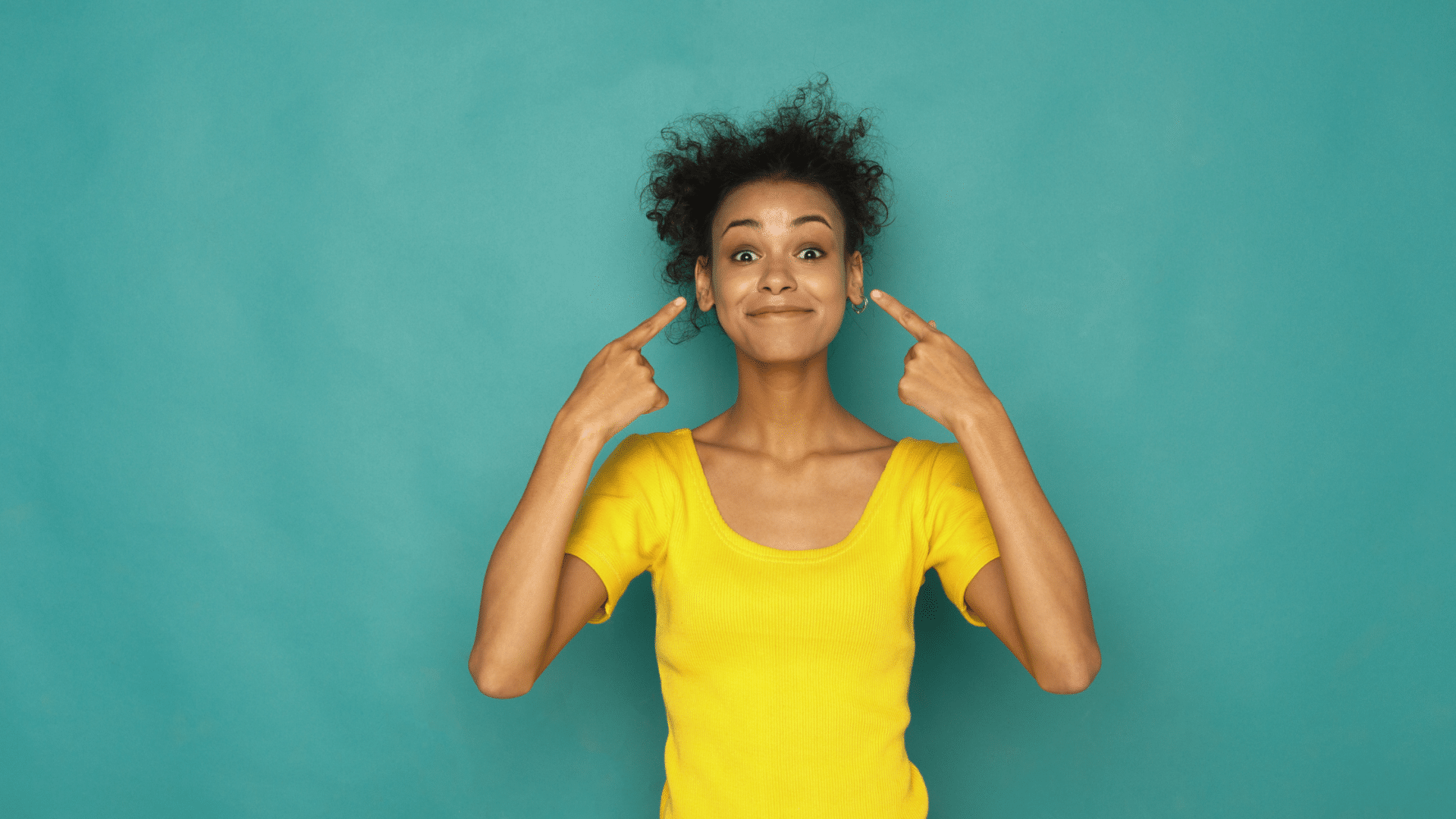 Untitled design (28) girl pointing to her ears